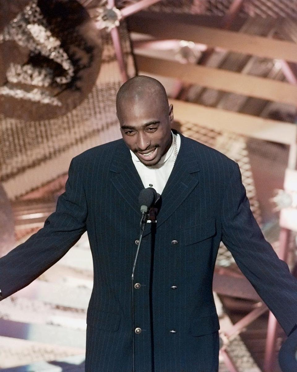 Tupac Shakur presents an award at the 38th annual Grammy Awards at the Shrine Auditorium.