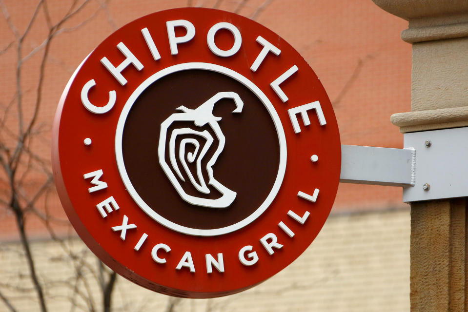 FILE - This Jan. 12, 2017, file photo shows the sign on a Chipotle restaurant in Pittsburgh. Federal prosecutors say Chipotle Mexican Grill has agreed to pay a record $25 million fine to resolve criminal charges that it served tainted food that sickened more than 1,100 people in the U.S. from 2015 to 2018. The fast food company was charged Tuesday, April 21, 2020 in Los Angeles federal court with two counts of violating the Food, Drug, and Cosmetic Act by serving adulterated food. The charges stem from outbreaks of norovirus, which causes diarrhea, at some Chipotle restaurants other than this location. (AP Photo/Gene J. Puskar, File)