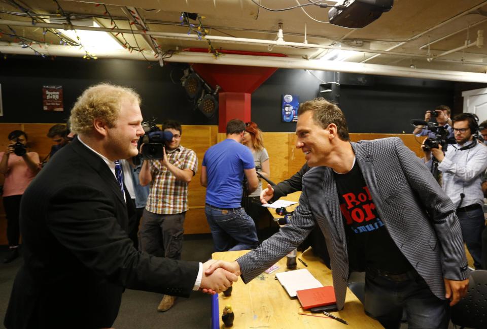 Travis Hay shakes hands with writer Brett McCaig before his audition for "Rob Ford The Musical: The Birth of a Ford Nation" in Toronto, June 16, 2014. Toronto Mayor Rob Ford, who shot to prominence last year after admitting to smoking crack, buying illegal drugs and driving after drinking, insisted for months he did not have a problem. But last month he said he would take time off to deal with his drinking issues. REUTERS/Mark Blinch (CANADA - Tags: POLITICS SOCIETY ENTERTAINMENT)