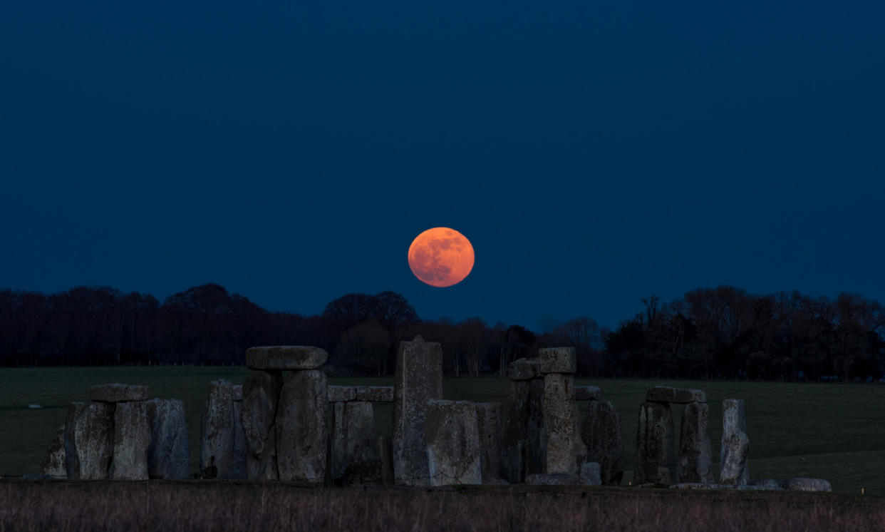 <span>The moon over Stonehenge, where scientists are researching connections between the monument and the satellite.</span><span>Photograph: André Pattenden/English Heritage</span>