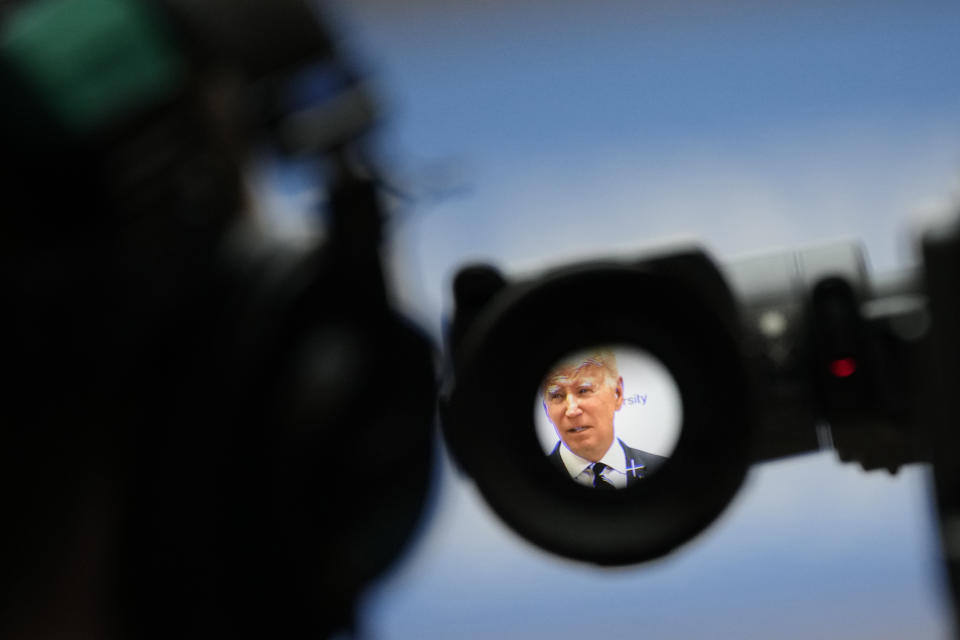 President Joe Biden seen through a TV camera viewfinder makes a speech about Northern Ireland's vast economic potential at the Ulster University's new campus in Belfast, Northern Ireland, Wednesday, April 12, 2023. President Biden is in Northern Ireland on Wednesday to participate in marking the 25th anniversary of the Good Friday Agreement, which brought peace to this part of the United Kingdom, as a new political crisis tests the strength of that peace.(AP Photo/Christophe Ena)