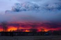 A wildfire moves towards the town of Anzac from Fort McMurray, Alta., on Wednesday May 4, 2016. THE CANADIAN PRESS/Jason Franson