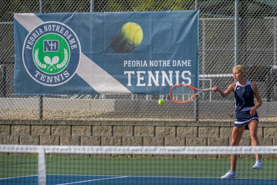 Peoria Notre Dame's Mary Breitbach returns a serve from Washington's Hailey Gerlach during a Sept. 26, 2022 match against Washington at Glen Oak Park in Peoria.