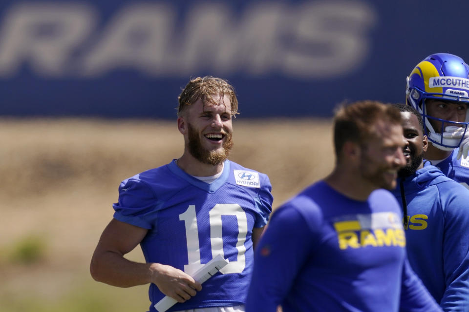 Los Angeles Rams wide receiver Cooper Kupp, center, laughs during an NFL mini camp football practice Wednesday, June 8, 2022, in Thousand Oaks, Calif. (AP Photo/Mark J. Terrill)