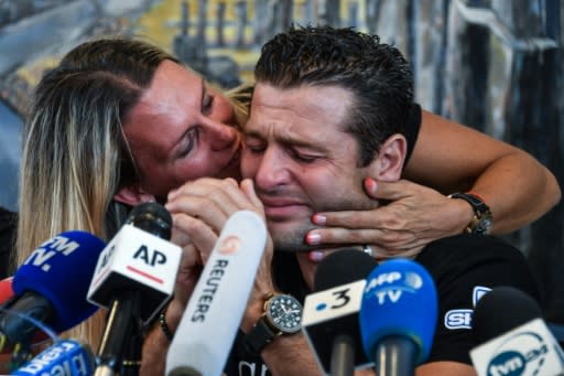 Franky Zapata got a peck of encouragement from his wife Krystel after he broke down in tears of emotion at a press conference in Sangatte, northern France, following his successful Channel crossing