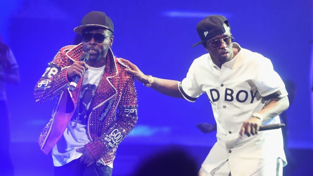 Black Rob (left) and Sean “Diddy” Combs aka Puff Daddy perform onstage during the Puff Daddy and The Family Bad Boy Reunion Tour presented by Ciroc Vodka and Live Nation at Barclays Center in May 2016. (Photo by Jamie McCarthy/Getty Images for Live Nation)