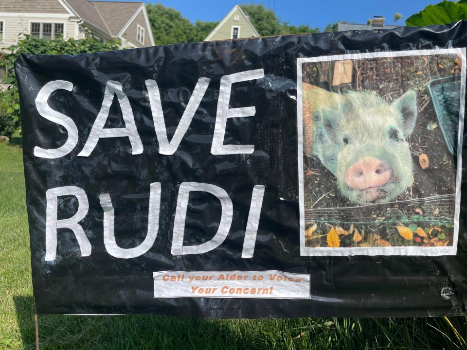 Many neighbors displayed "Save Rudi" signs along Madison's Southwest Commuter bike path, where Rudi and his family have a home.