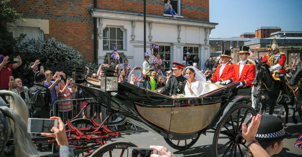 London: Prince Harry, Duke of Sussex and Meghan, Duchess of Sussex leave Windsor Castle in Ascot Landau carriage during a procession after getting married at St Georges Chapel