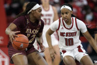 North Carolina State guard Aziaha James (10) guards against Elon forward Ajia James (12) during the second half of an NCAA college basketball game in Raleigh, N.C., Sunday, Dec. 5, 2021. (AP Photo/Gerry Broome)