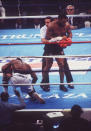10. Mike Tyson KO1 Michael Spinks, June 27, 1988 – This fight was Tyson at his peak, as he terrorized a petrified Spinks. It was a matchup of two unbeaten men holding heavyweight belts, but Spinks was battered around until Tyson stopped him. Tyson decked Spinks with a right to the body about 70 seconds into the fight. Spinks got up, but Tyson went right after him and quickly knocked him out with a short right hand. (Photo Credit: Getty)