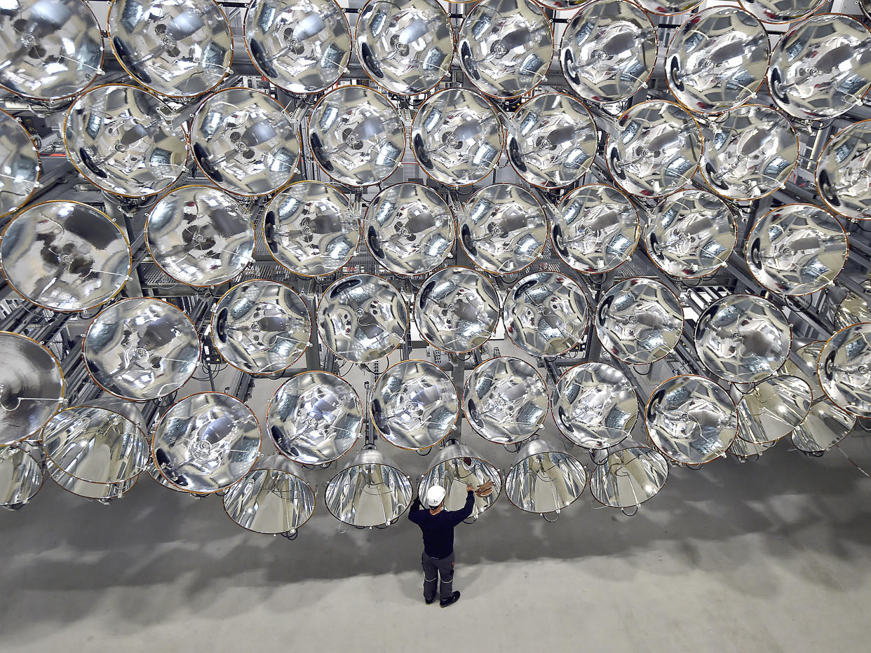 Photo engineer Volkmar Dohmen stands in front of xenon short-arc lamps in the DLR German national aeronautics and space research center in Juelich, western Germany: AP