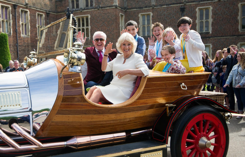 LONDON, ENGLAND - JUNE 08:  Camilla, Duchess of Cornwall and Chris Evans depart in 'Chitty Chitty Bang Bang' after attending the live broadcast of the final of BBC Radio 2's 500 Words creative writing competition along with the winning children at Hampton Court Palace on June 8, 2018 in London, England.  (Photo by Tim P. Whitby/Tim P. Whitby/Getty Images)