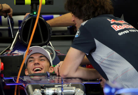 Toro Rosso Formula One driver Pierre Gasly of France sits in his car in the team garage at Interlagos circuit in Sao Paulo, Brazil November 9, 2017. REUTERS/Paulo Whitaker