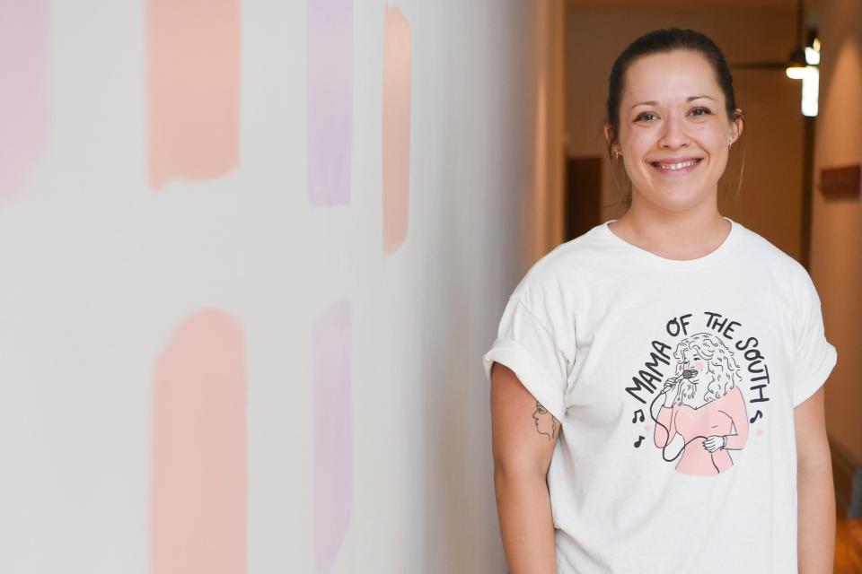 Knoxville native artist Paris Woodhull poses for a photo in her new storefront and studio on the 100 block of Gay Street in downtown Knoxville, Tuesday, Aug. 2, 2022. Woodhull hopes to open the space by the beginning of September. 