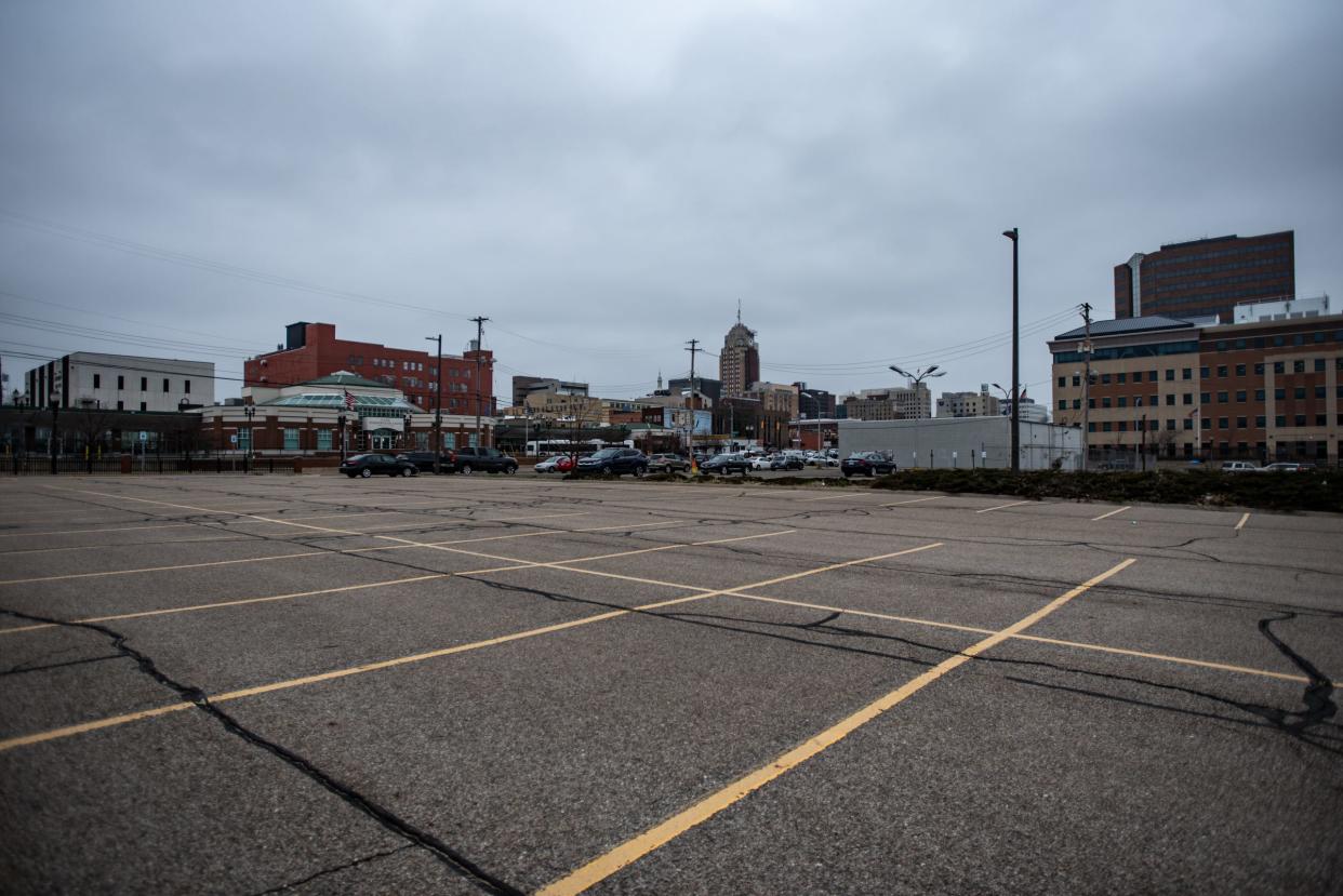 A parking lot on the northeast corner of East Lenawee Street and South Grand Avenue in Lansing, pictured Friday, March 8, 2024.