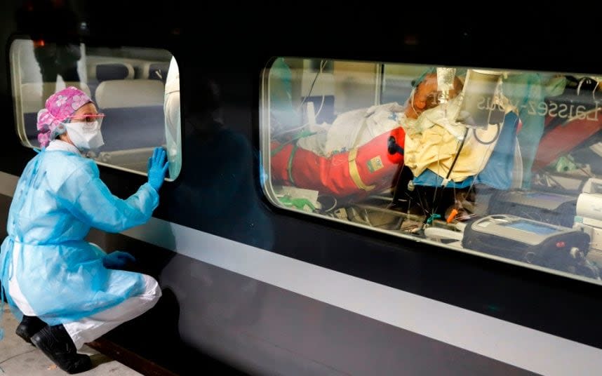 Some 36 patients are being transported in two separate medicalised TGV carriages from Paris hospitals to others in Brittany where the outbreak has been limited so far - AFP