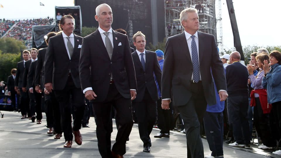 Captains Pavin (L) and Montgomerie lead out their teams at the 2010 Ryder Cup. - Ross Kinnaird/Getty Images