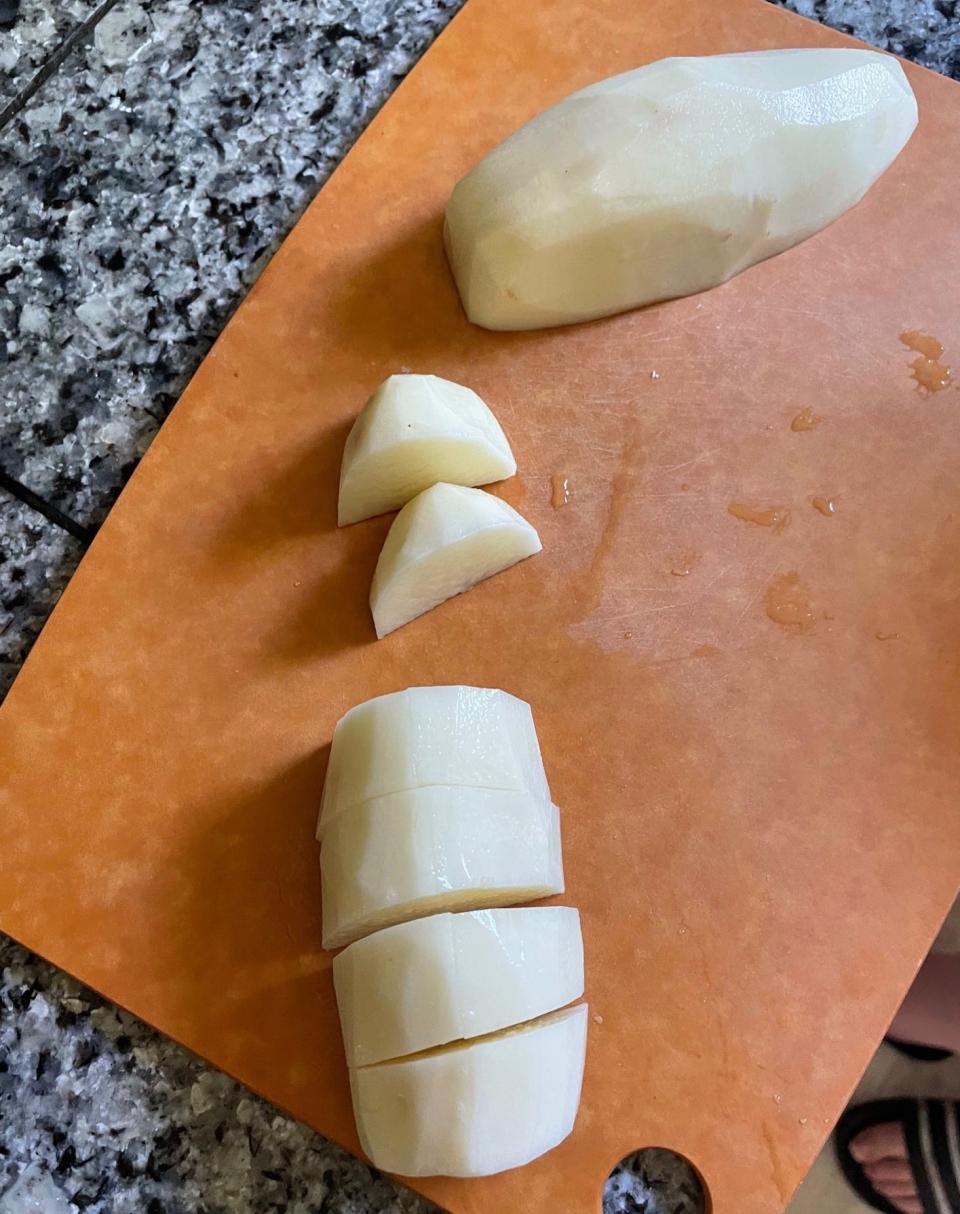 Cutting potatoes for Dad's Greek Lemon Potatoes