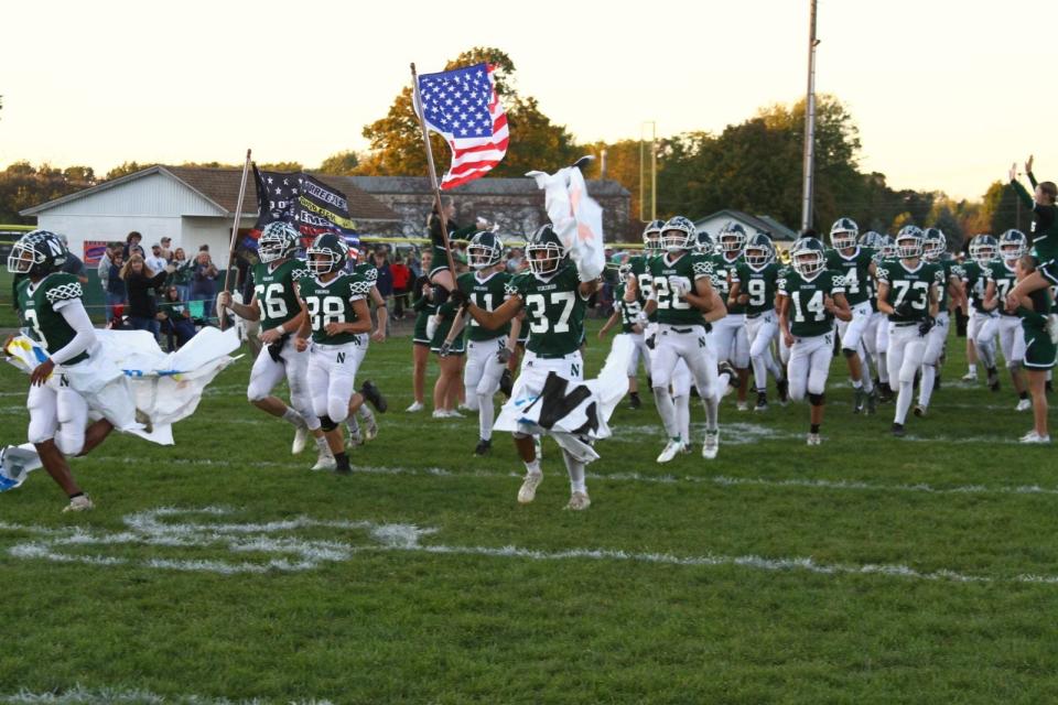 Northridge takes the field at Viking Stadium prior to its 2021 victory against Lakewood.