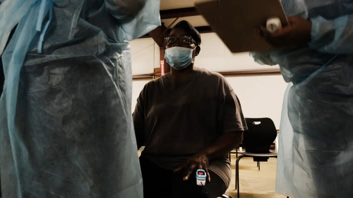 Barbara Belton gets a shot of the Moderna Covid-19 vaccination from medical workers with Delta Health Center in Hollandale, Mississippi. The state has worked to vaccinate residents in remote areas who may not have access to the internet or to transportation. (Photo by Spencer Platt/Getty Images)