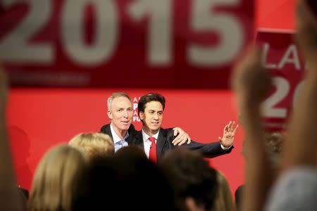 Leader of Britain's opposition Labour party Ed Miliband (R) reacts with the leader of the Scottish Labour Party Jim Murphy at an election rally in Glasgow, May 1, 2015. REUTERS/Paul Hackett