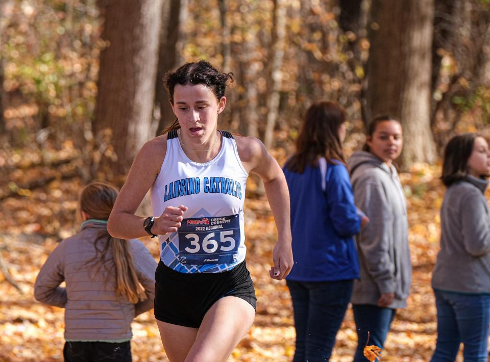 Lansing Catholic's CC Jones, (365) finishes in second place in the  D3 Girls Regional Cross Country race Saturday, Oct, 29, 2022. 