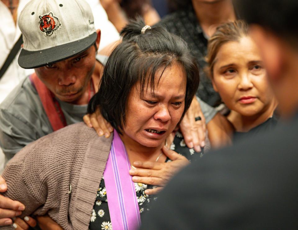 The mother of the 13-year-old boy who was shot and killed by Utica Police cries after listening to a translator inside City Hall in Utica, New York on Saturday, June 29, 2024.