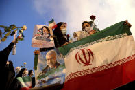 Supporters of Iranian president-elect Ebrahim Raisi celebrate after he won the presidential election in Tehran, Iran, Saturday, June 19, 2021. Initial results released Saturday propelled Raisi, a protege of the country's supreme leader, into Tehran’s highest civilian position. The vote appeared to see the lowest turnout in the Islamic Republic’s history. (AP Photo/Ebrahim Noroozi)