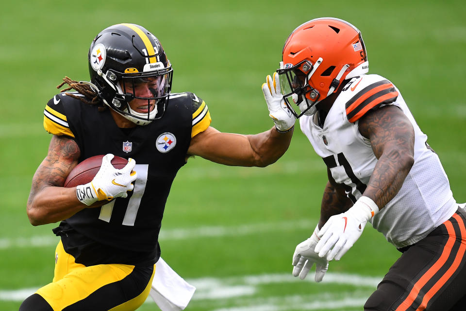 PITTSBURGH, PENNSYLVANIA - OCTOBER 18: Chase Claypool #11 of the Pittsburgh Steelers stiff arms Mack Wilson #51 of the Cleveland Browns during their NFL game at Heinz Field on October 18, 2020 in Pittsburgh, Pennsylvania. (Photo by Joe Sargent/Getty Images)