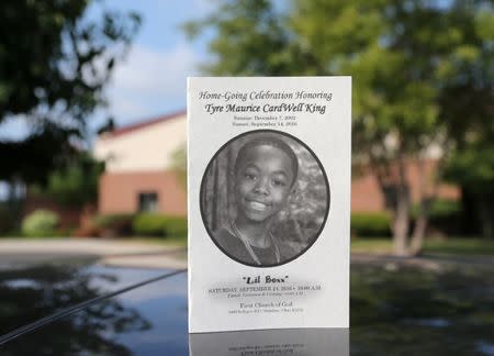 The funeral program for Tyre King, a 13-year-old African-American youth shot last week by a white police officer, is seen outside the First Church of God of in Columbus, Ohio, September 24, 2016. REUTERS/Aaron Josefczyk