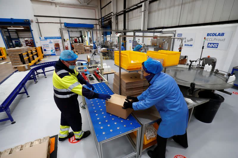 Ecolab employees on the filling line prepare the Skinman Soft Protect FF virucidal hand rub that is supplied to the NHS