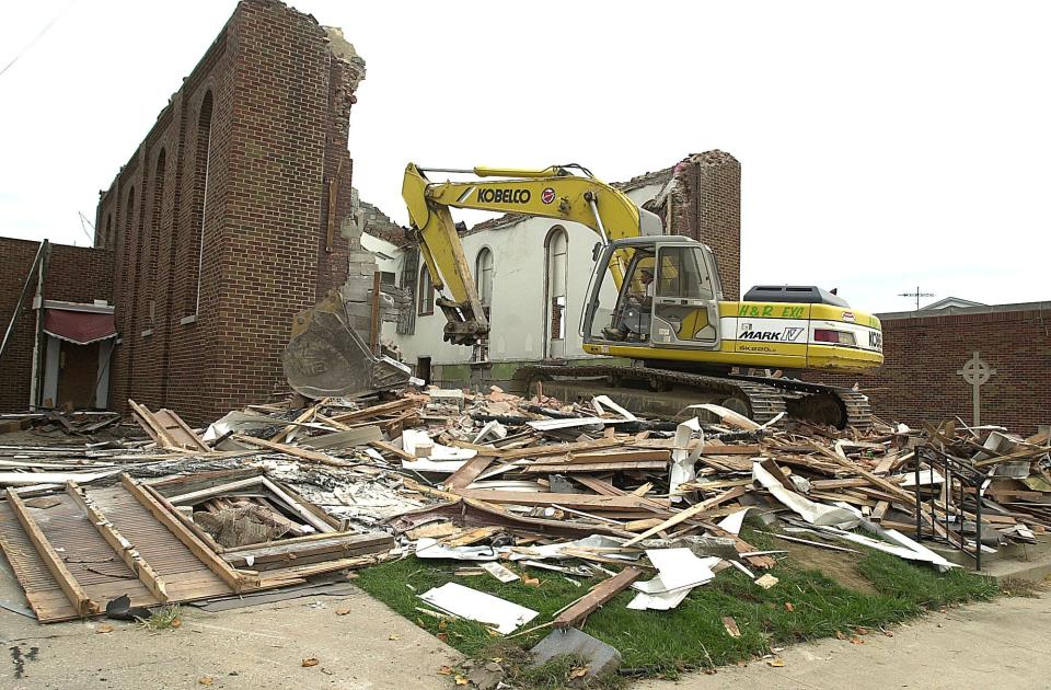 The old St. Edward Church is demolished in this October 2002 photo. The church bell that was saved from the cupola will be placed in a free-standing tower next to the church.