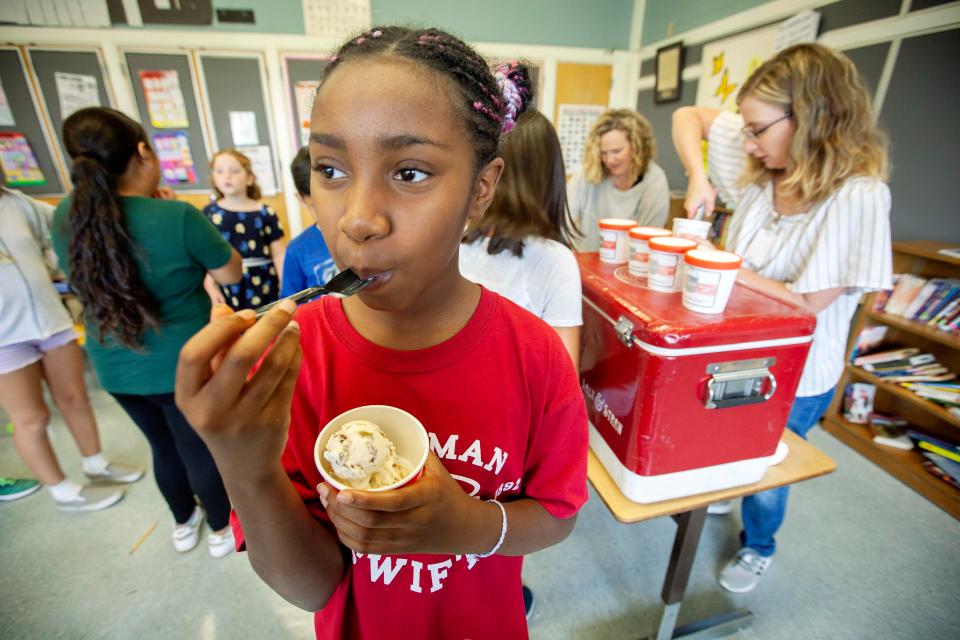 Shamiah Rivers, a 5th grader at Chapman Elementary School tries a new Salt & Straw ice cream flavor, I Oat You One, that was invented by two of her fellow students, Katharina and Izzy.