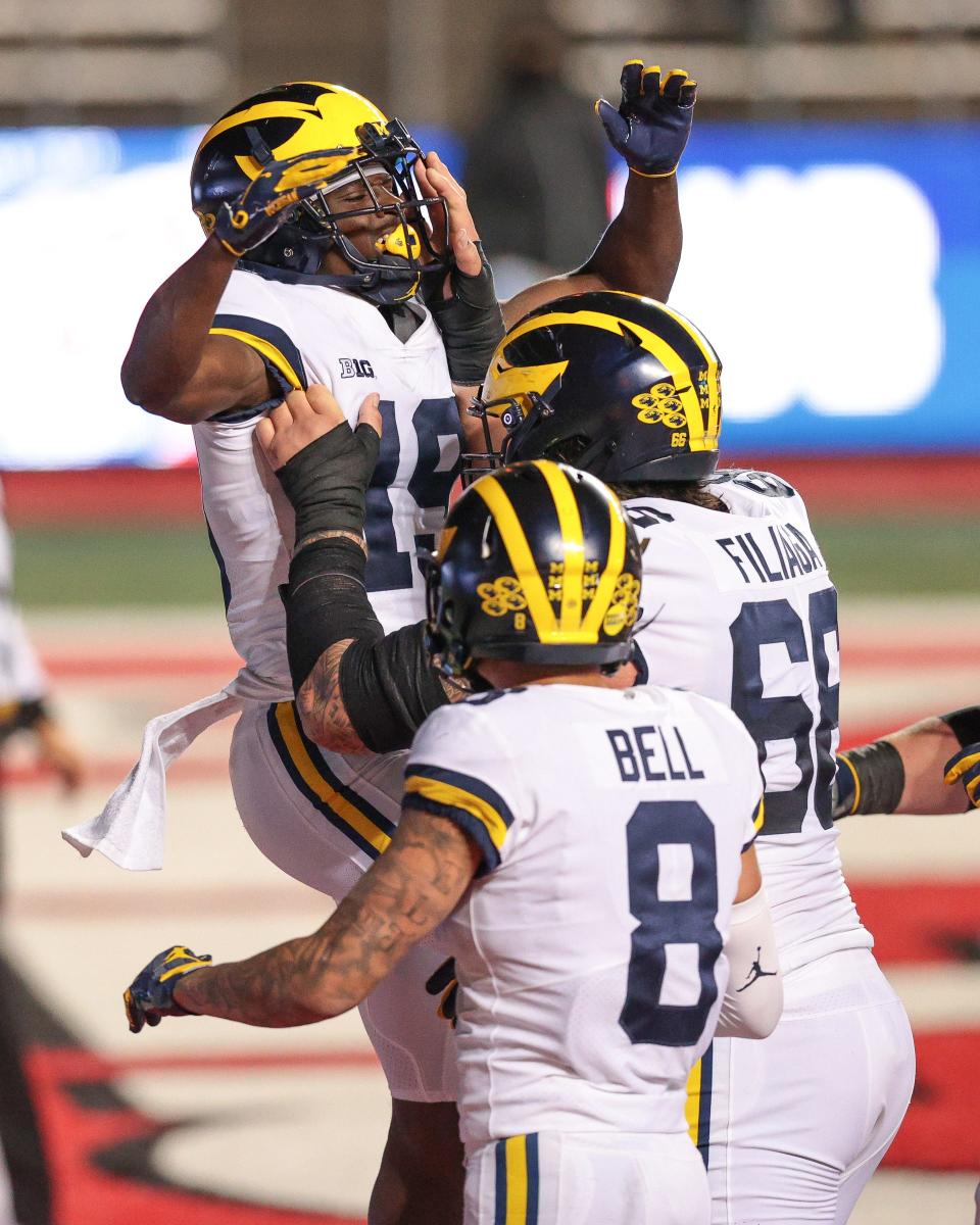 Michigan Wolverines wide receiver Mike Sainristil (19) celebrates his touchdown with teammates during the second half Nov. 21, 2020, against the Rutgers Scarlet Knights at SHI Stadium.