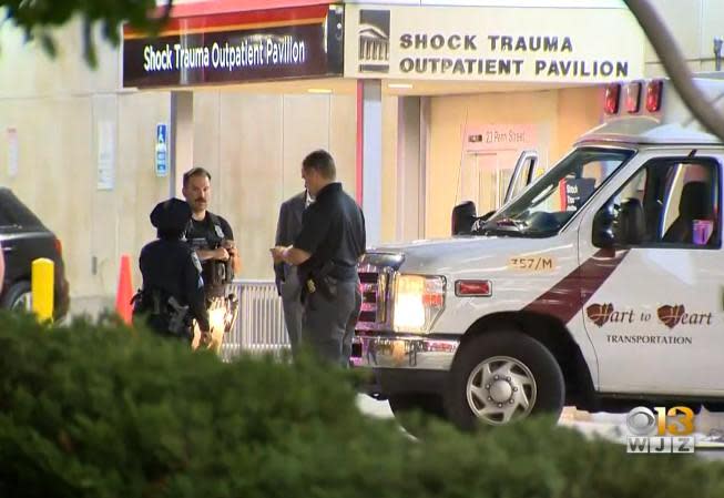 Baltimore police wait outside hospital one of their own was raced to after he was hit by a vehicle and dragged about two blocks on night of June 28, 2022. The hospital is the                  University of Maryland R Adams Cowley Shock Trauma Center. / Credit: CBS Baltimore