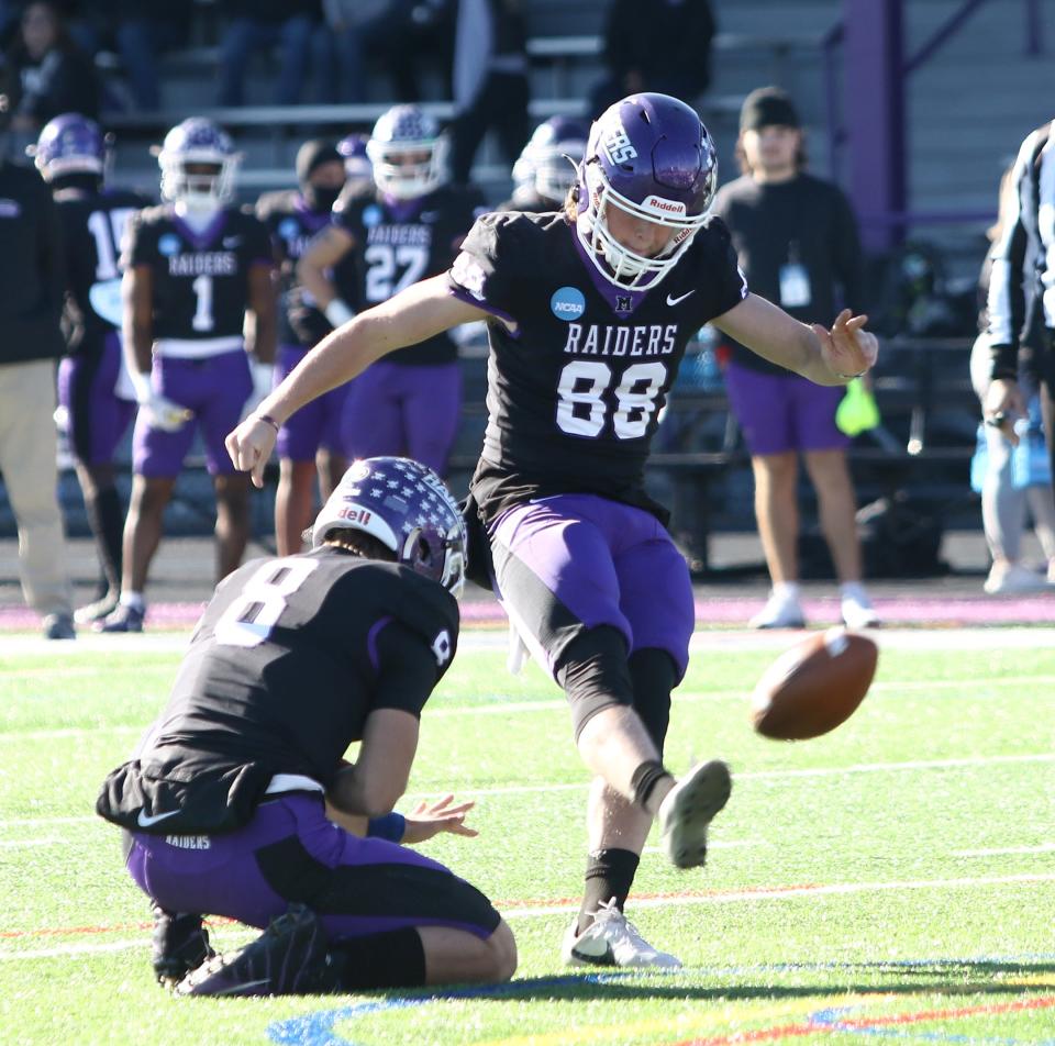 Mount Union's Elliott Warner kicks a field goal held by Noah Beaudrie against Utica during an NCAA Division III playoff game on Saturday, November 26, 2022.