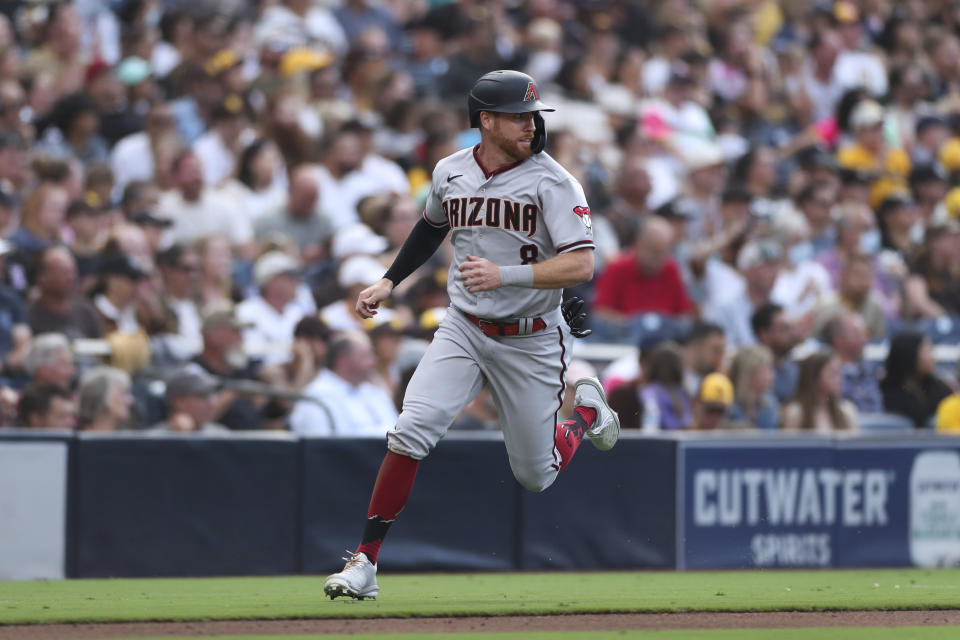 Arizona Diamondbacks' Jordan Luplow rounds third base on the way to scoring on a triple by Buddy Kennedy during the fourth inning of a baseball game against the San Diego Padres, Saturday, July 16, 2022, in San Diego. (AP Photo/Derrick Tuskan)