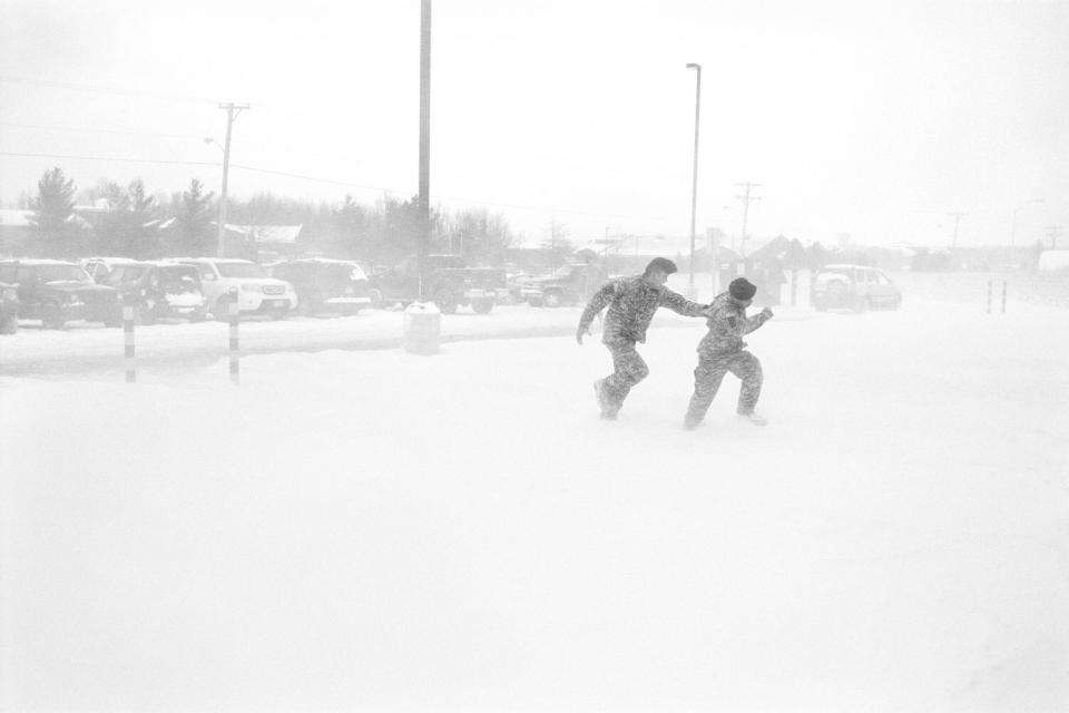 Two soldiers play in a blizzard at Fort Drum, N.Y. January 2010.