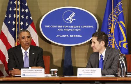 U.S. President Barack Obama sits next to the Director of the CDC Tom Frieden as he participates in a briefing, on efforts to control the Ebola virus, at the Centers for Disease Control and Prevention in Atlanta, Georgia, September 16, 2014. REUTERS/Larry Downing