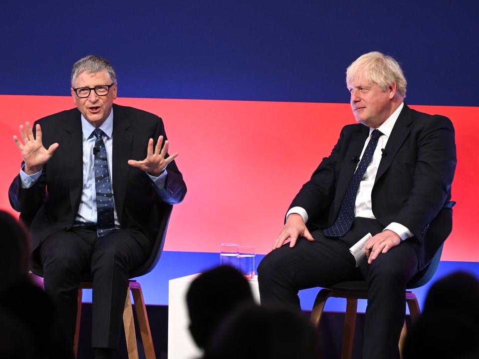 Johnson appears on stage in conversation with Gates during the Global Investment Summit (Getty)