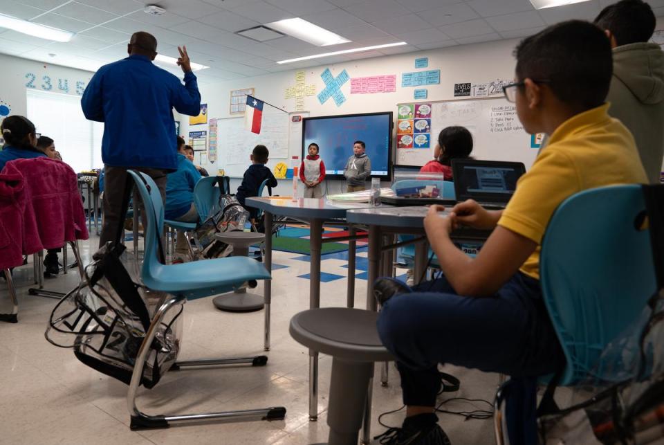 Third grade teacher Eran McGowan watches students demonstrate their answers to the class at the Eddie Bernice Johnson STEM Academy in Dallas, Texas on Feb. 5, 2024.