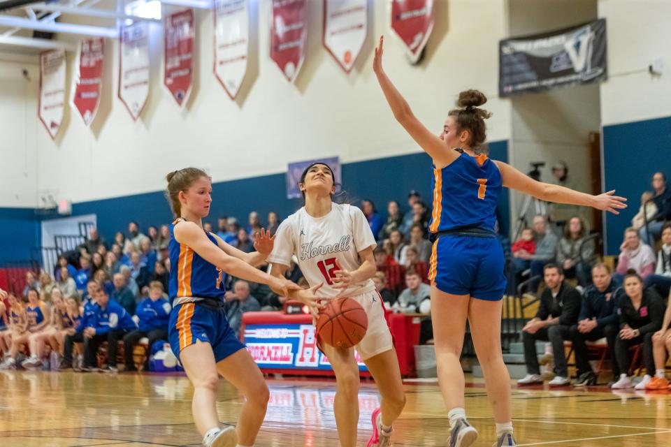 Hornell guard Selena Maldonado splits the Livonia defense on her way to the hoop Saturday during the Section V playoff win over Livonia. The Red Raiders advance to face Wellsville Wednesday in the semifinals.