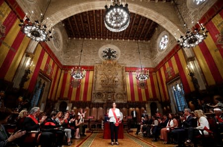 Ada Colau poses during her swearing-in ceremony as the new mayor of Barcelona, at Barcelona's town hall