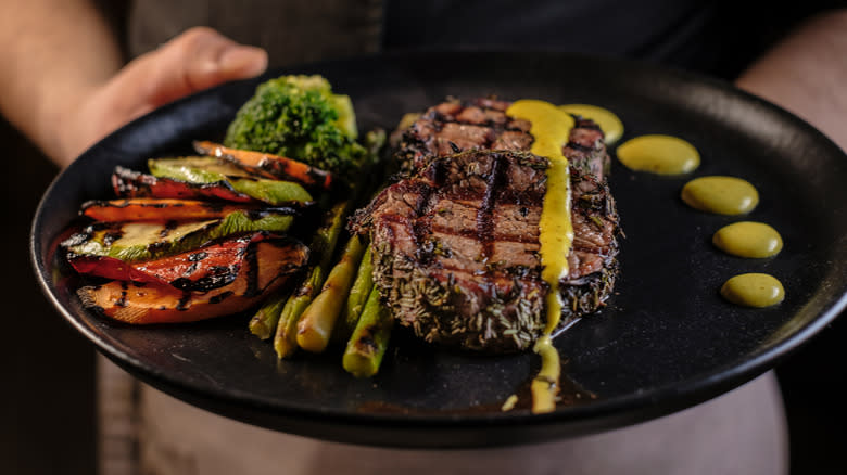 Steak and vegetables on plate