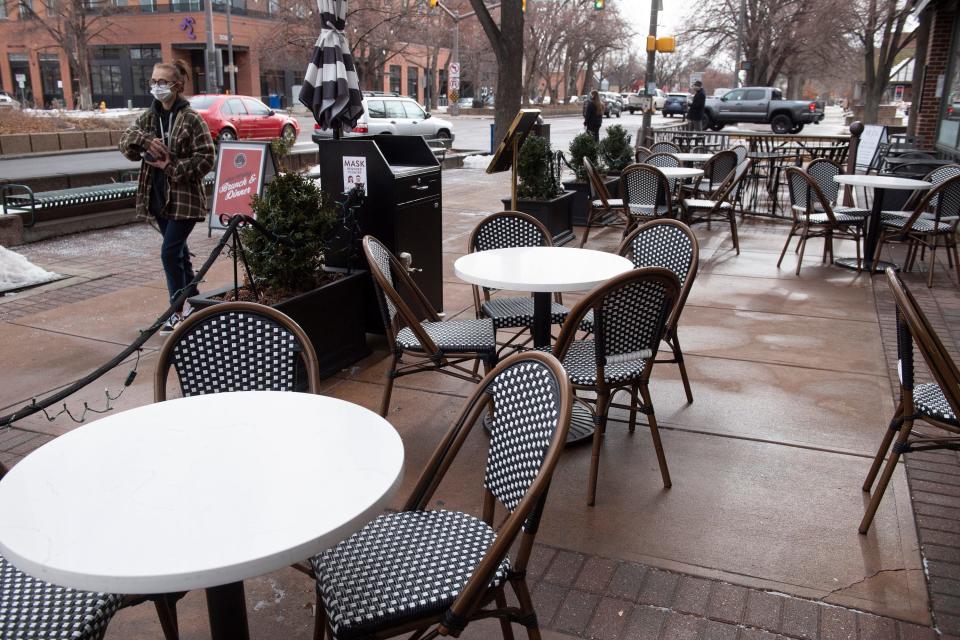 Tables and chairs are set up for outdoor dining at the entrance to the Armstrong Hotel in Fort Collins on Friday. Nearly two years into the COVID-19 pandemic, the city of Fort Collins is considering a move to make its COVID-born expanded outdoor patio program permanent.