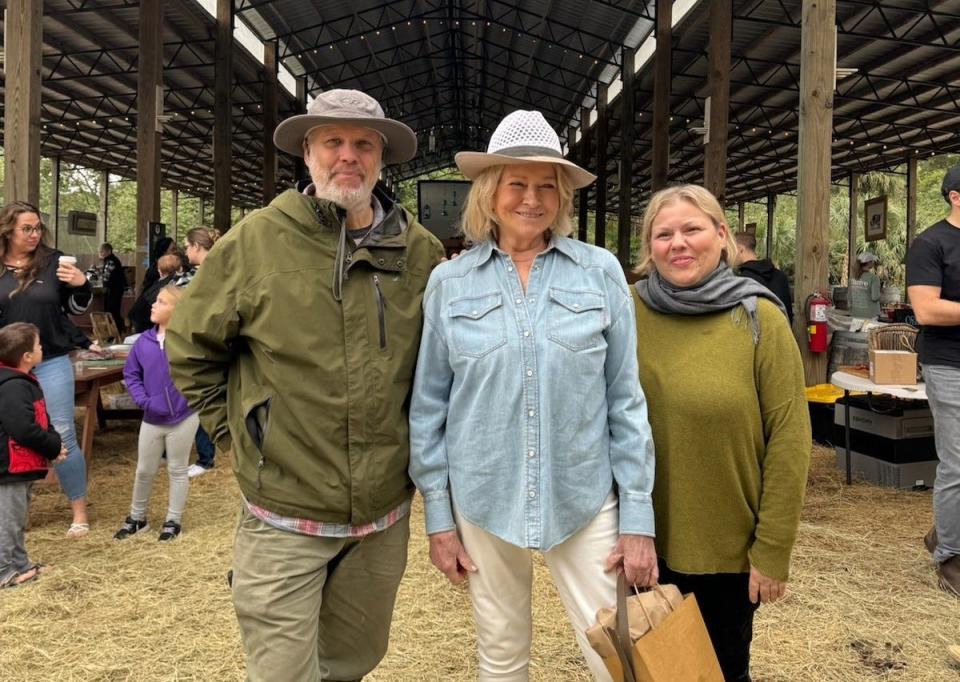 Lifestyle and food star Martha Stewart shares a snapshot with farmers Darrin and Jodi Swank at their Swank Farm in Loxahatchee Groves in December 2023.