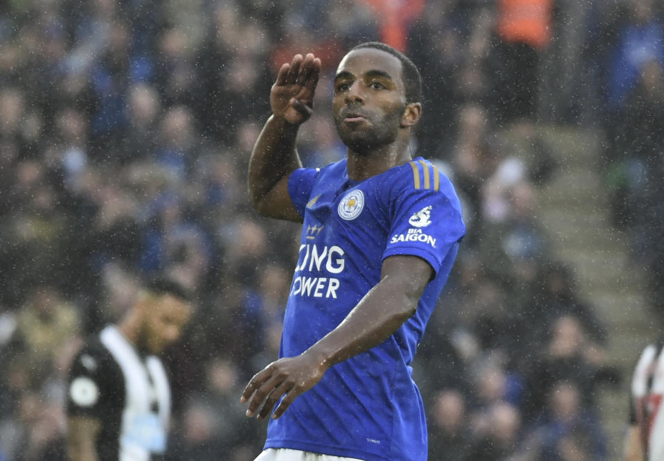 Leicester's Ricardo Pereira celebrates after scoring the opening goal under heavy rain during the English Premier League soccer match between Leicester City and Newcastle United at the King Power Stadium in Leicester, England, Sunday, Sept. 29, 2019. (AP Photo/Rui Vieira)