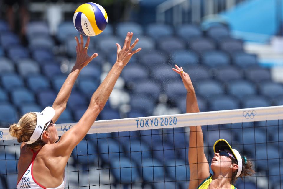 TOKYO, JAPAN - AUGUST 06: Mariafe Artacho del Solar #1 of Team Australia hits the ball against Alix Klineman #2 of Team United States during the Women's Gold Medal Match of the Tokyo 2020 Olympic Games at Shiokaze Park. (Photo by Elsa/Getty Images)