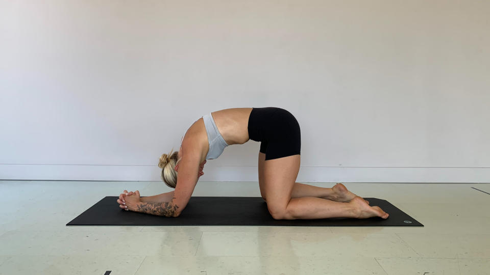 Woman doing Cat Cow stretch for low back pain relief