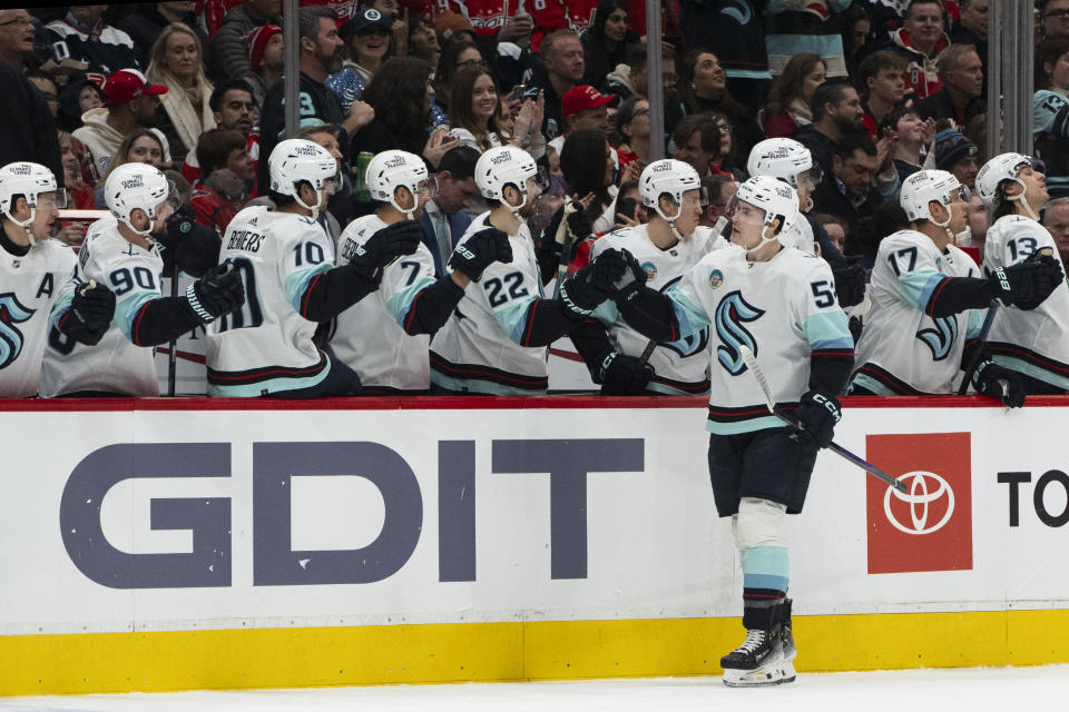 Seattle Kraken left wing Tye Kartye (52) is congratulated for a goal against the Washington Capitals during the first period of an NHL hockey game Thursday, Jan. 11, 2024, in Washington. (AP Photo/Manuel Balce Ceneta)